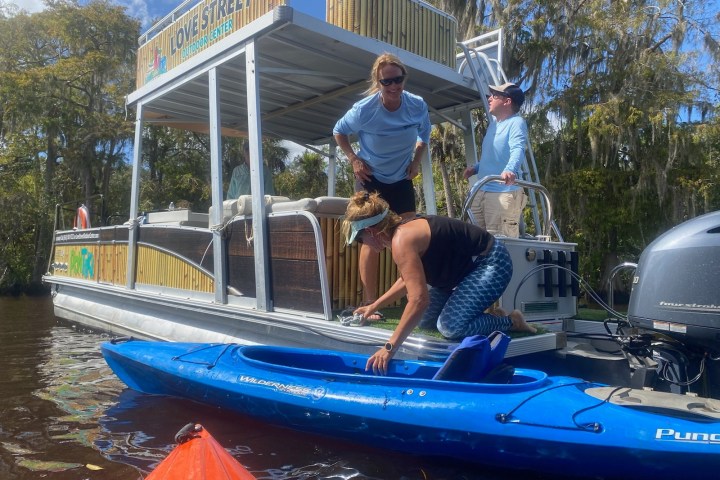 a man riding on the back of a boat