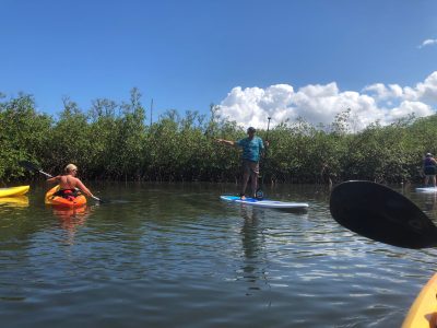 a group of people on a boat in the water