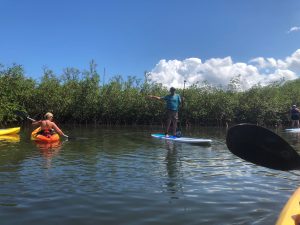 a group of people on a boat in the water