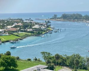 a large body of water with a city in the background