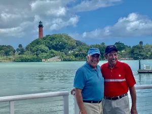 Joe Namath standing next to a body of water